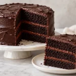 Linda’s Fudge Cake recipe with three chocolate cake layers and fudge frosting